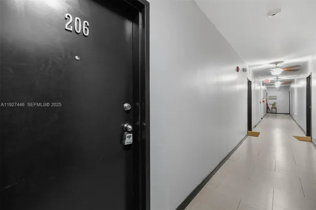 a view of a hallway with wooden shelves