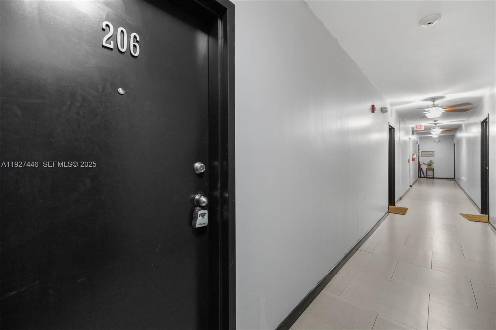 1876 Southwest 11th Terrace, Unit 206 Miami, FL 33135 - Photo 15 of 15 a view of a hallway with wooden shelves