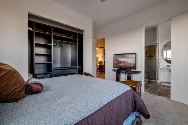 a view of a swimming pool with lounge chairs