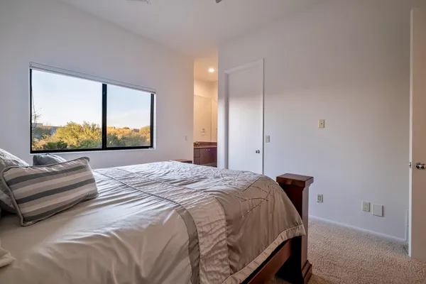a view of a house with backyard porch and sitting area