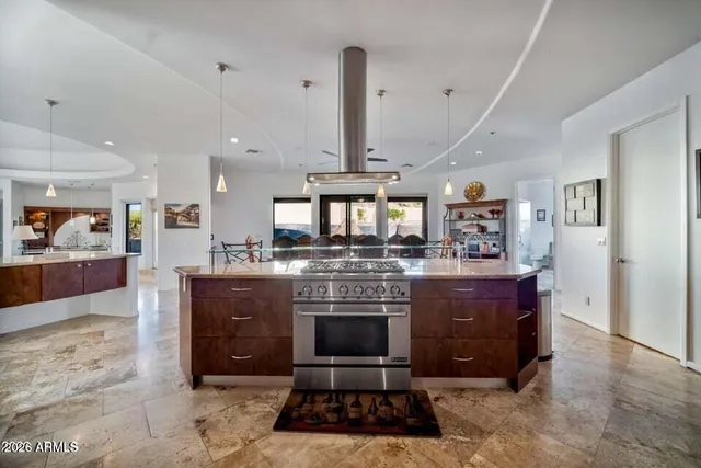 a bedroom with a bed couch and window