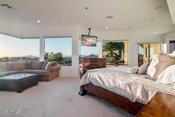 a spacious bathroom with a double vanity sink mirror and bathtub