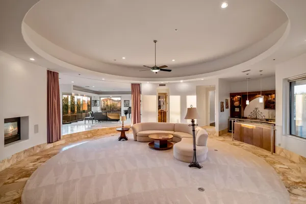 an aerial view of a house with a mountain