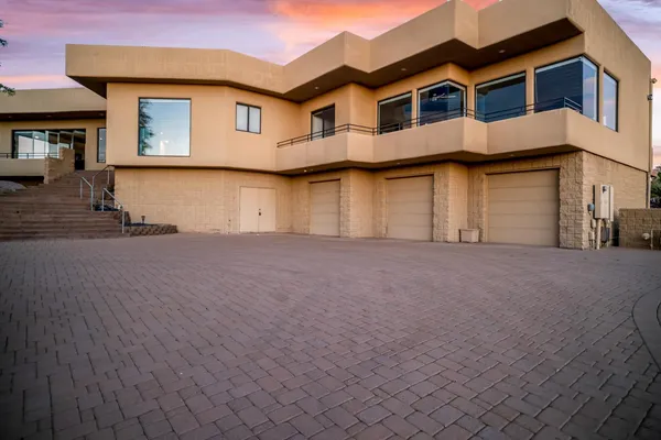 an aerial view of a house a swimming pool outdoor seating and outdoor space
