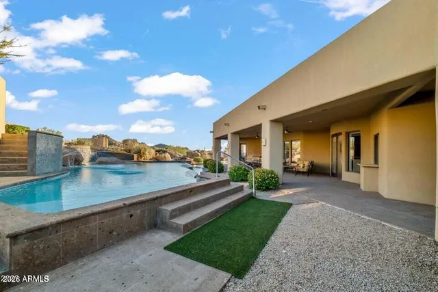 a view of swimming pool with outdoor seating
