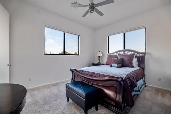 a bed room with a bed and a window