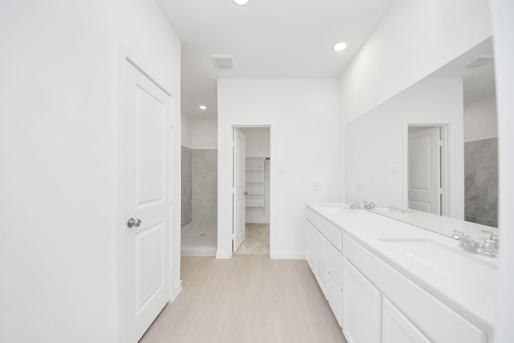 10650 Ellerston Road Cleveland, TX 77327 - Photo 13 of 25 The bathroom features a long double sink