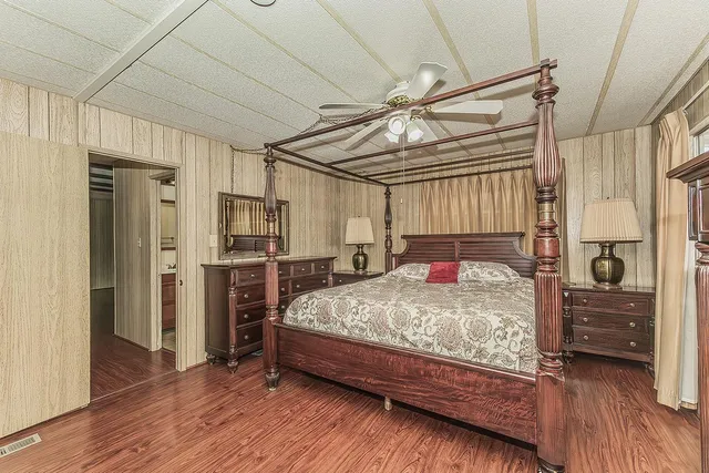 a bedroom with a bed and a walk in closet