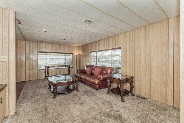 a living room with furniture and a window