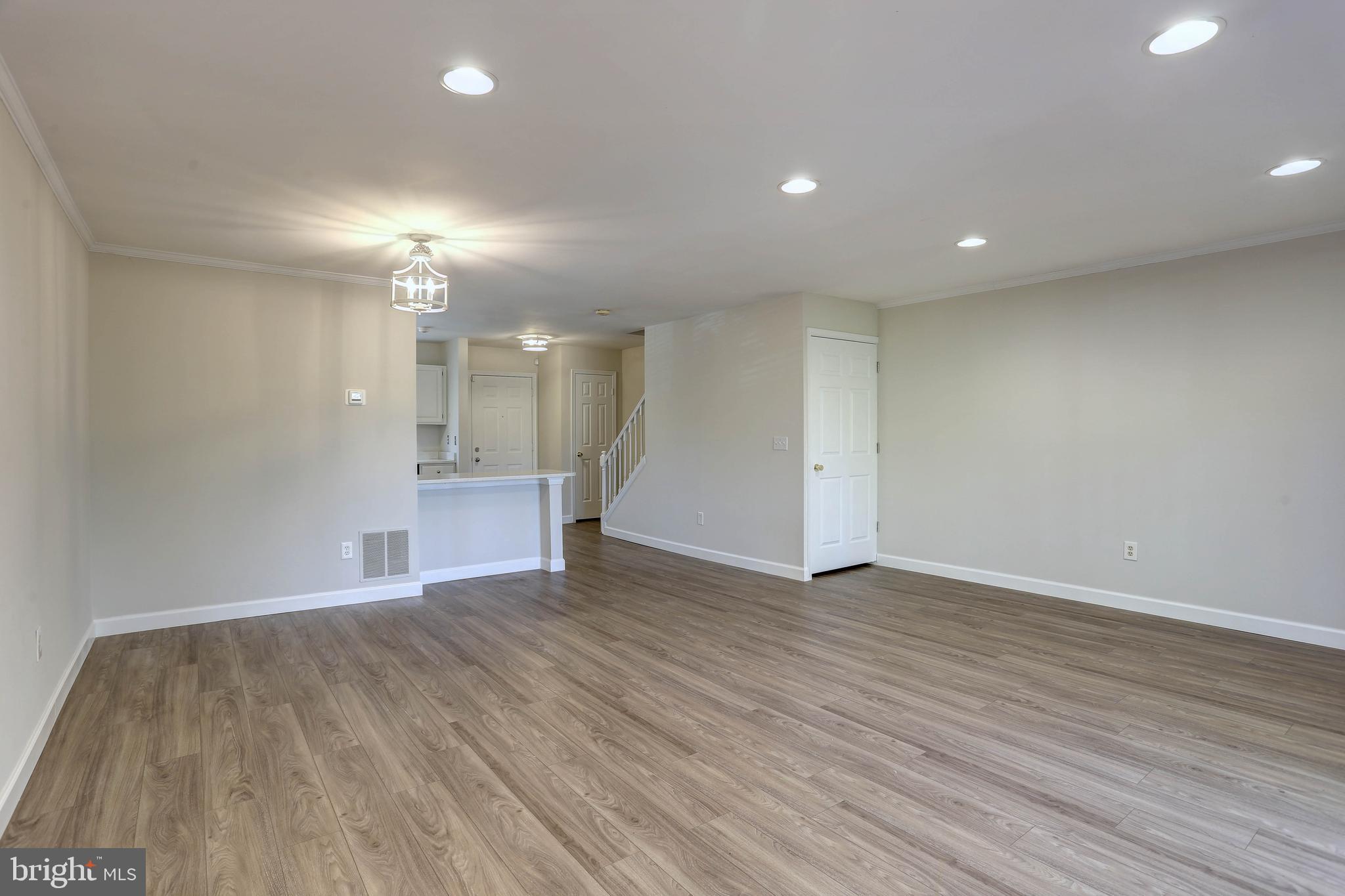 20 Bryans Mill Way Baltimore, MD 21228 - Photo 13 of 36 a view of empty room with wooden floor