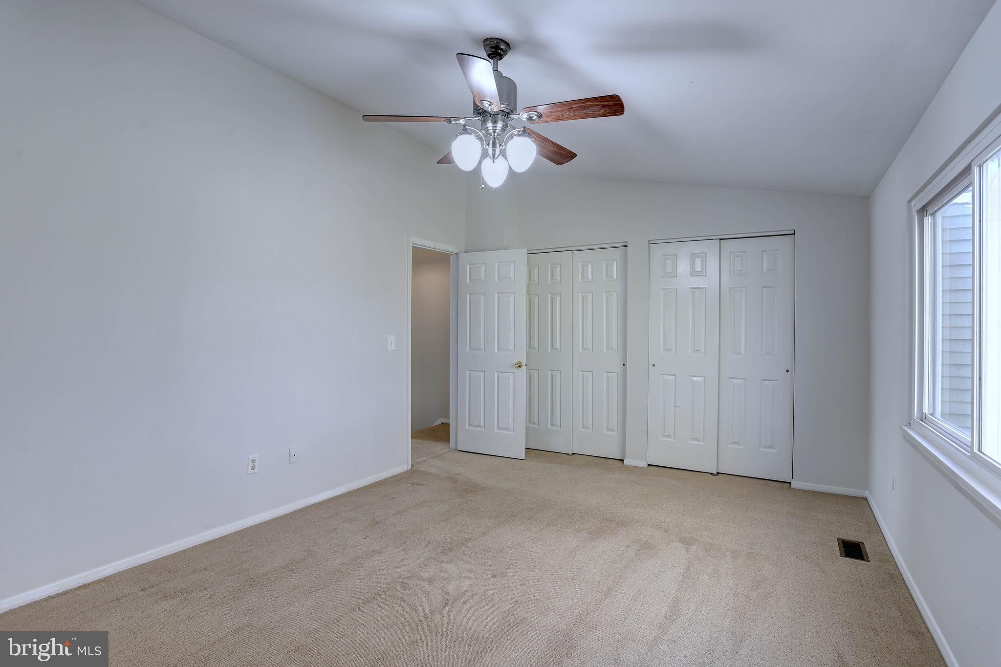 20 Bryans Mill Way Baltimore, MD 21228 - Photo 17 of 36 a view of an empty room with a window