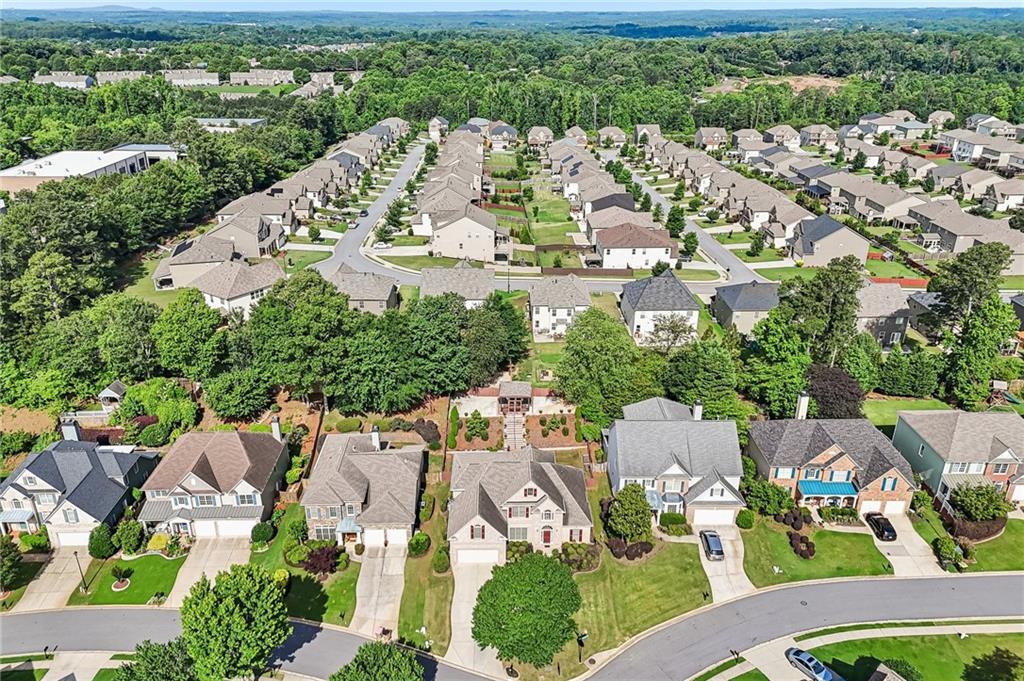 810 Freedom Way Cumming, GA 30040 - Photo 56 of 61 an aerial view of residential houses with outdoor space and street view