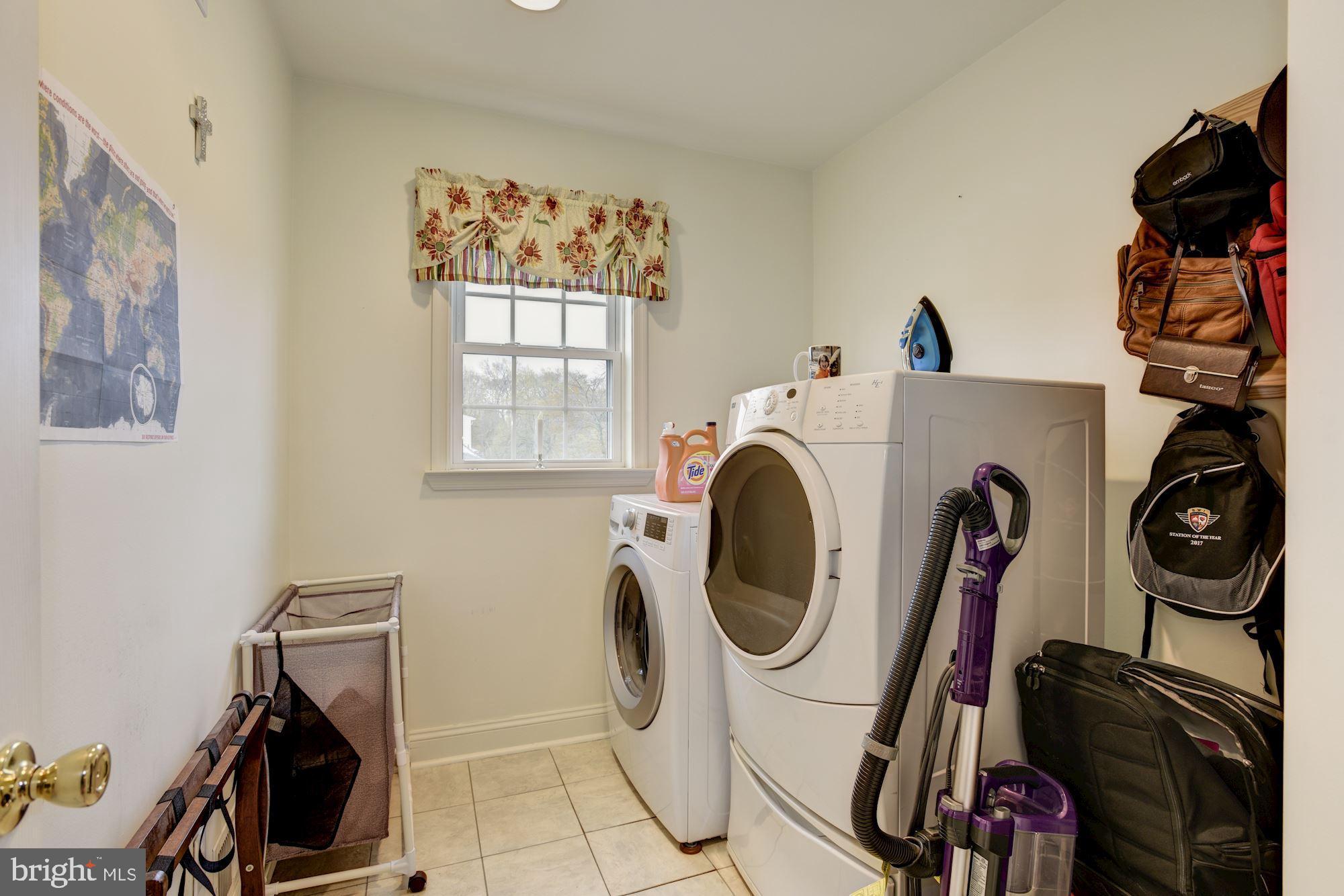 306 Homewood Road Linthicum, MD 21090 - Photo 16 of 32 a utility room with dryer washer and a window