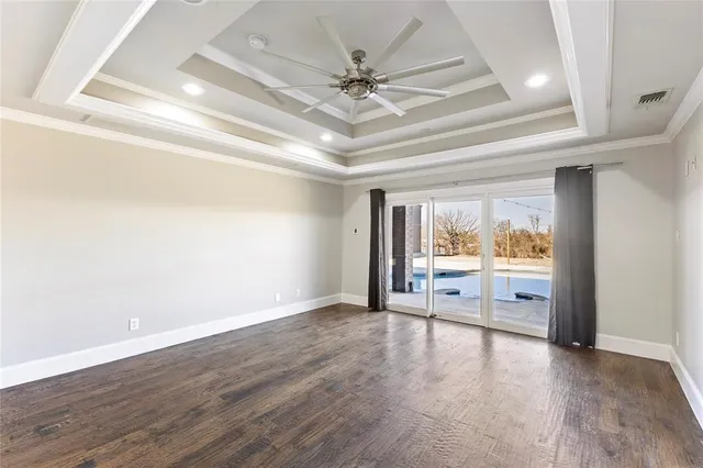 a large white bathroom with a large tub sink vanity and granite