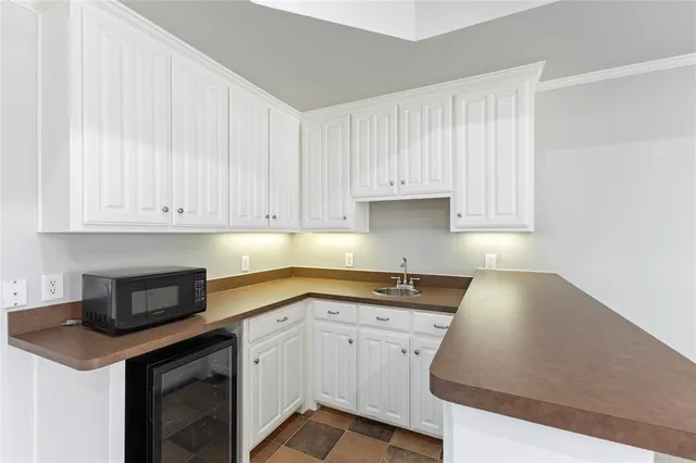 a bathroom with a sink a large mirror and a shower