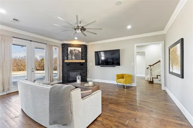 a living room with fireplace furniture and a flat screen tv