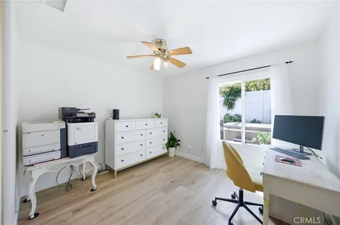 a workspace with furniture and a window