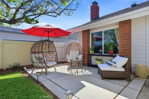 a view of swimming pool with outdoor seating