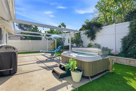 a view of a chairs and table in the patio