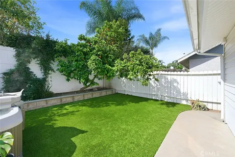 a view of a backyard with a small cabin