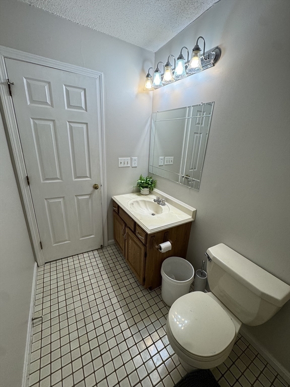 200 Lambert Terrace, Unit 41 Chicopee, MA 01020 - Photo 14 of 24 a bathroom with a sink a toilet a mirror and shower