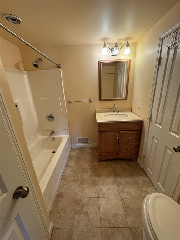 200 Lambert Terrace, Unit 41 Chicopee, MA 01020 - Photo 18 of 24 a bathroom with a tub sink and mirror