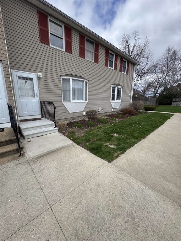 200 Lambert Terrace, Unit 41 Chicopee, MA 01020 - Photo 2 of 24 a front view of a house with garden