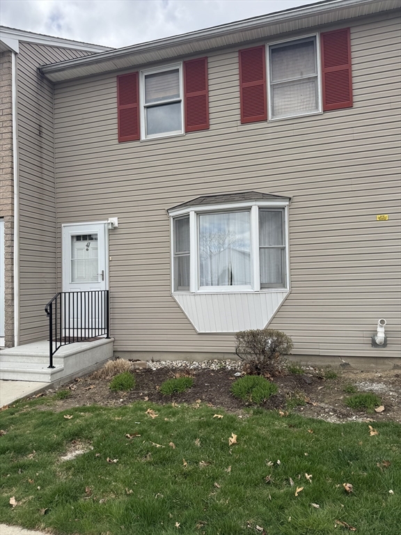 200 Lambert Terrace, Unit 41 Chicopee, MA 01020 - Photo 3 of 24 a front view of a house with a yard