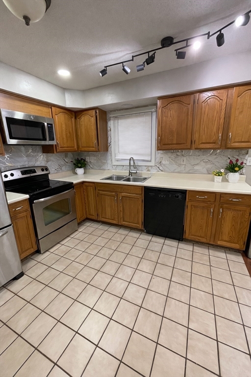 200 Lambert Terrace, Unit 41 Chicopee, MA 01020 - Photo 7 of 24 a kitchen with stainless steel appliances granite countertop a sink and cabinets