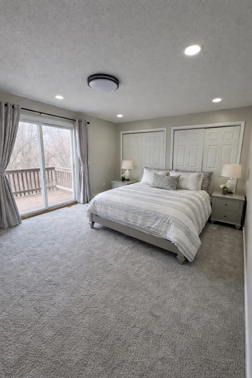 200 Lambert Terrace, Unit 41 Chicopee, MA 01020 - Photo 10 of 24 a spacious bedroom with a large bed and a large window