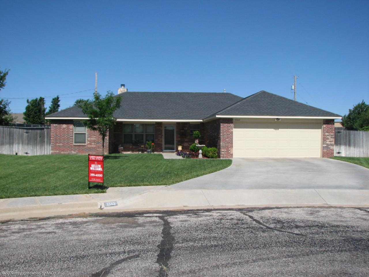 6602 Slater Circle Amarillo, TX 79110 - Photo 1 of 25 a front view of a house with a yard and garage