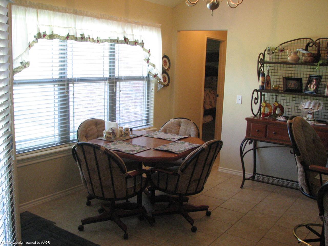 6602 Slater Circle Amarillo, TX 79110 - Photo 13 of 25 a dining room with furniture and window