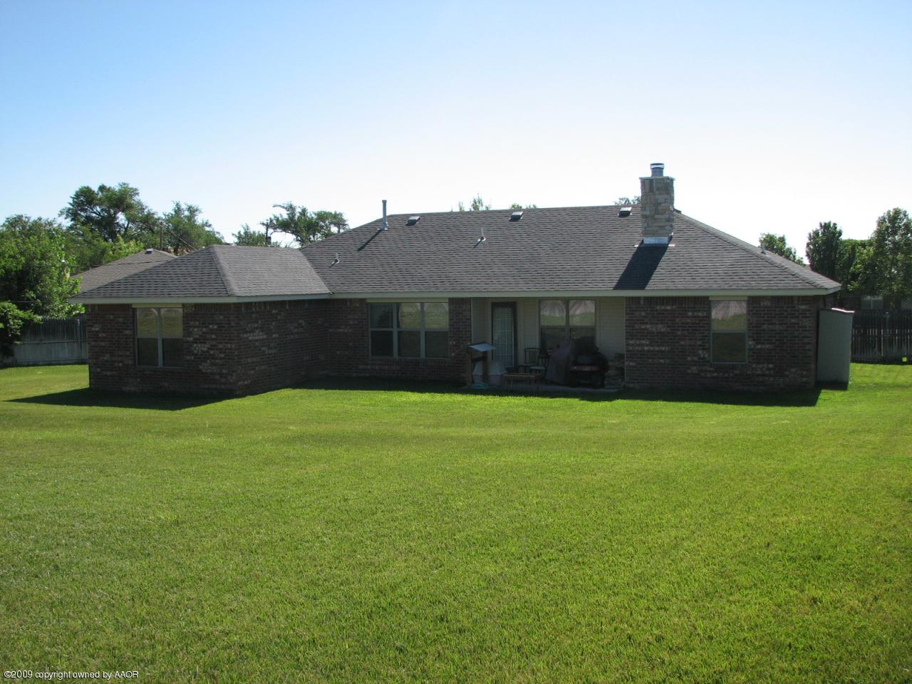 6602 Slater Circle Amarillo, TX 79110 - Photo 18 of 25 a front view of a house with a garden