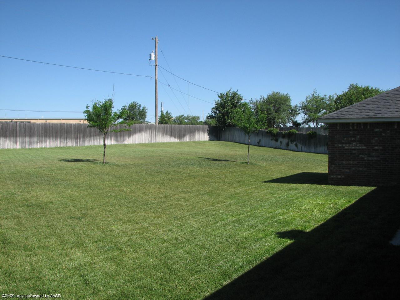 6602 Slater Circle Amarillo, TX 79110 - Photo 19 of 25 a view of a garden with a tree