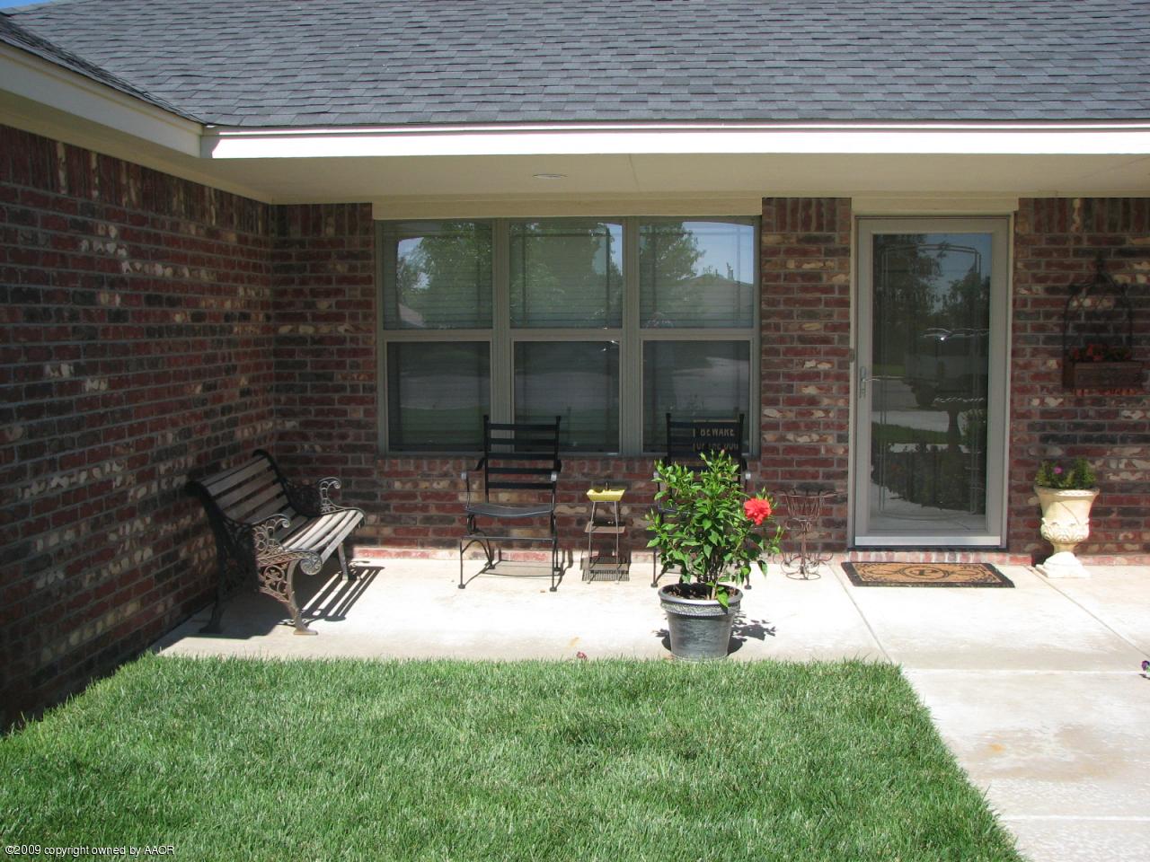 6602 Slater Circle Amarillo, TX 79110 - Photo 24 of 25 a view of a house with a porch and a potted plant