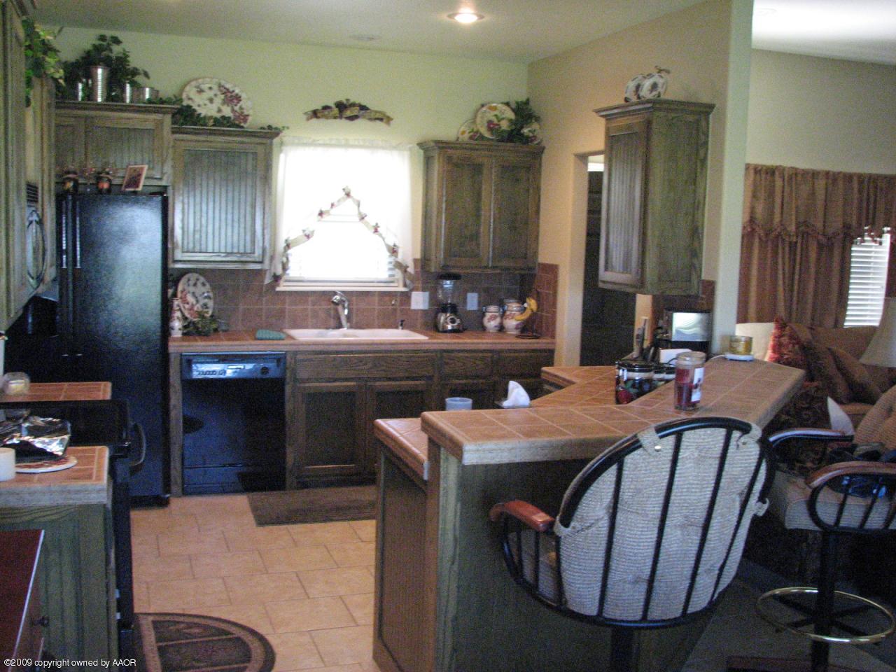 6602 Slater Circle Amarillo, TX 79110 - Photo 3 of 25 a dining room with furniture and window