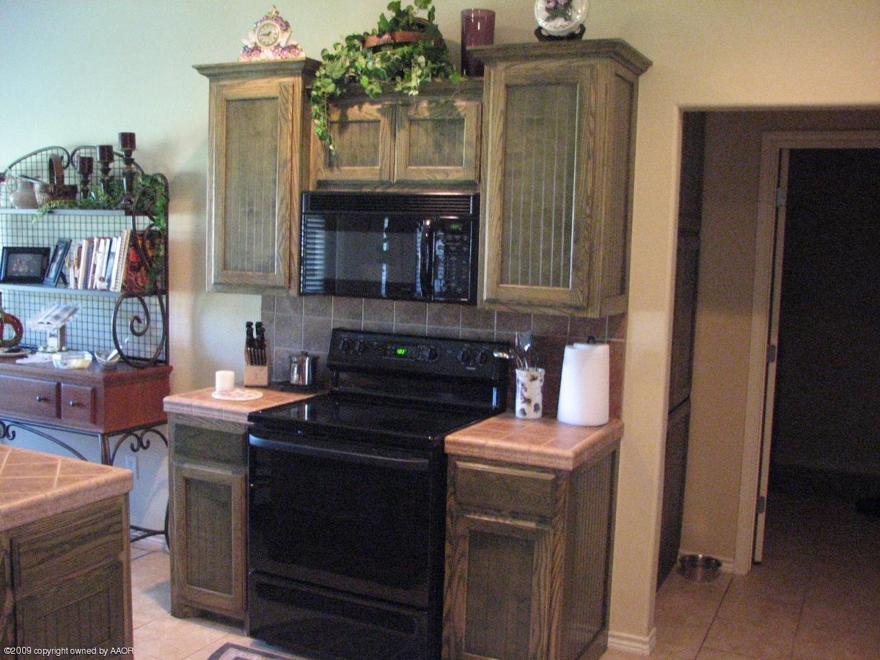 6602 Slater Circle Amarillo, TX 79110 - Photo 10 of 25 a kitchen with a sink and cabinets