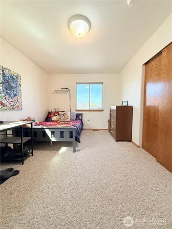 a bed room with a bed and a couch