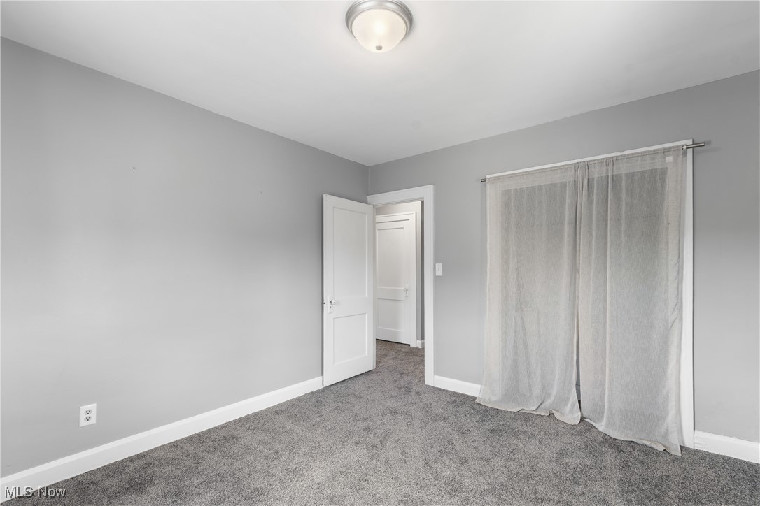 302 Poplar Avenue Northwest Canton, OH 44708 - Photo 21 of 34 Unfurnished bedroom with carpet floors and baseboards