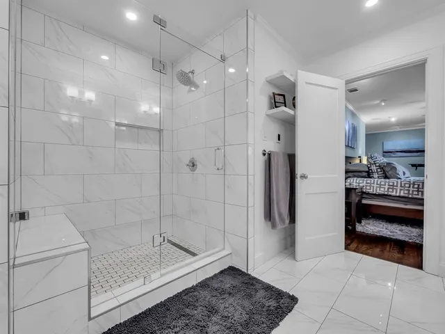 a bathroom with a shower and a sink