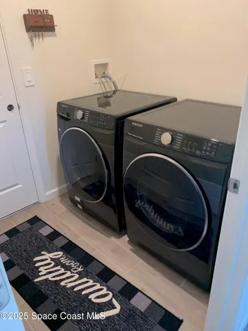 a close up of a washing machine in a utility room