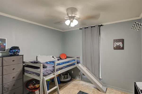 a bed room with a bed and a chandelier