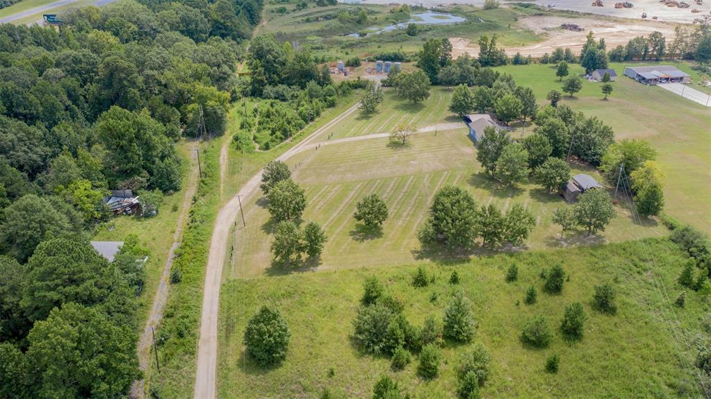 4807 Greenwood Heights Road Greenwood, LA 71033 - Photo 20 of 21 an aerial view of residential houses with outdoor space and trees all around