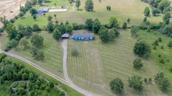 an aerial view of residential house with outdoor space