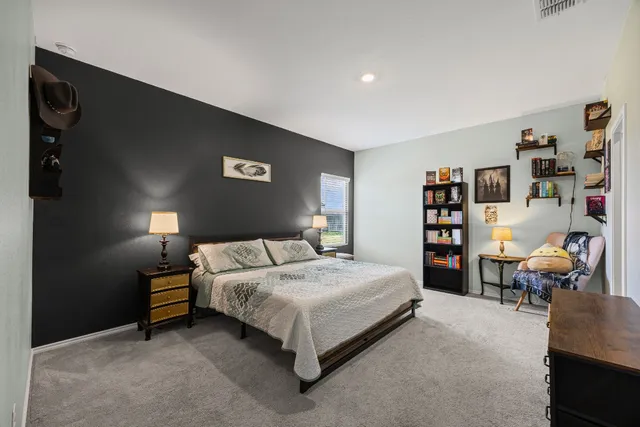 a bedroom with a bed and furniture