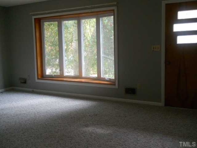 4104 Campbell Road Raleigh, NC 27606 - Photo 2 of 6 Spacious living room showing bay window.