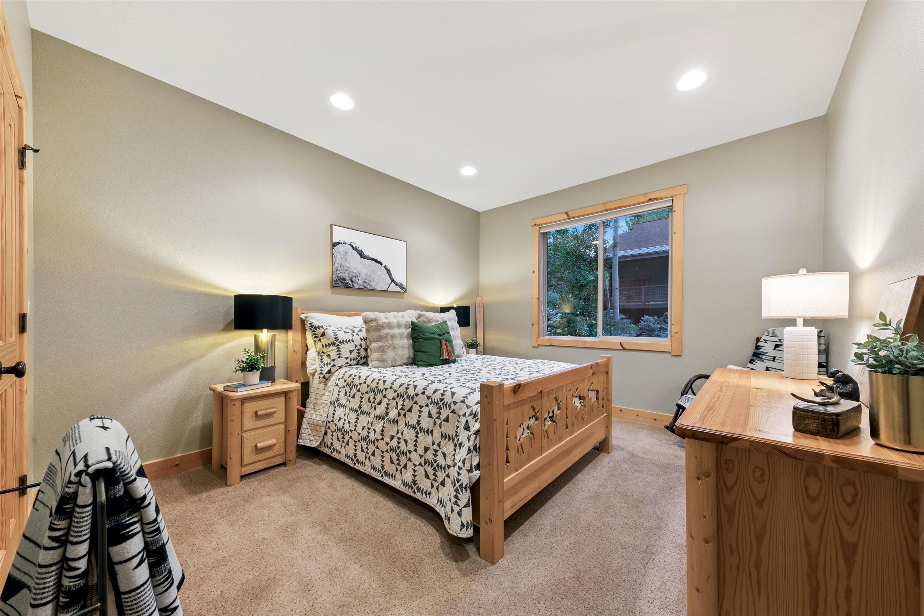 11781 Chamonix Road Truckee, CA 96161 - Photo 16 of 28 a bed room with a bed and window