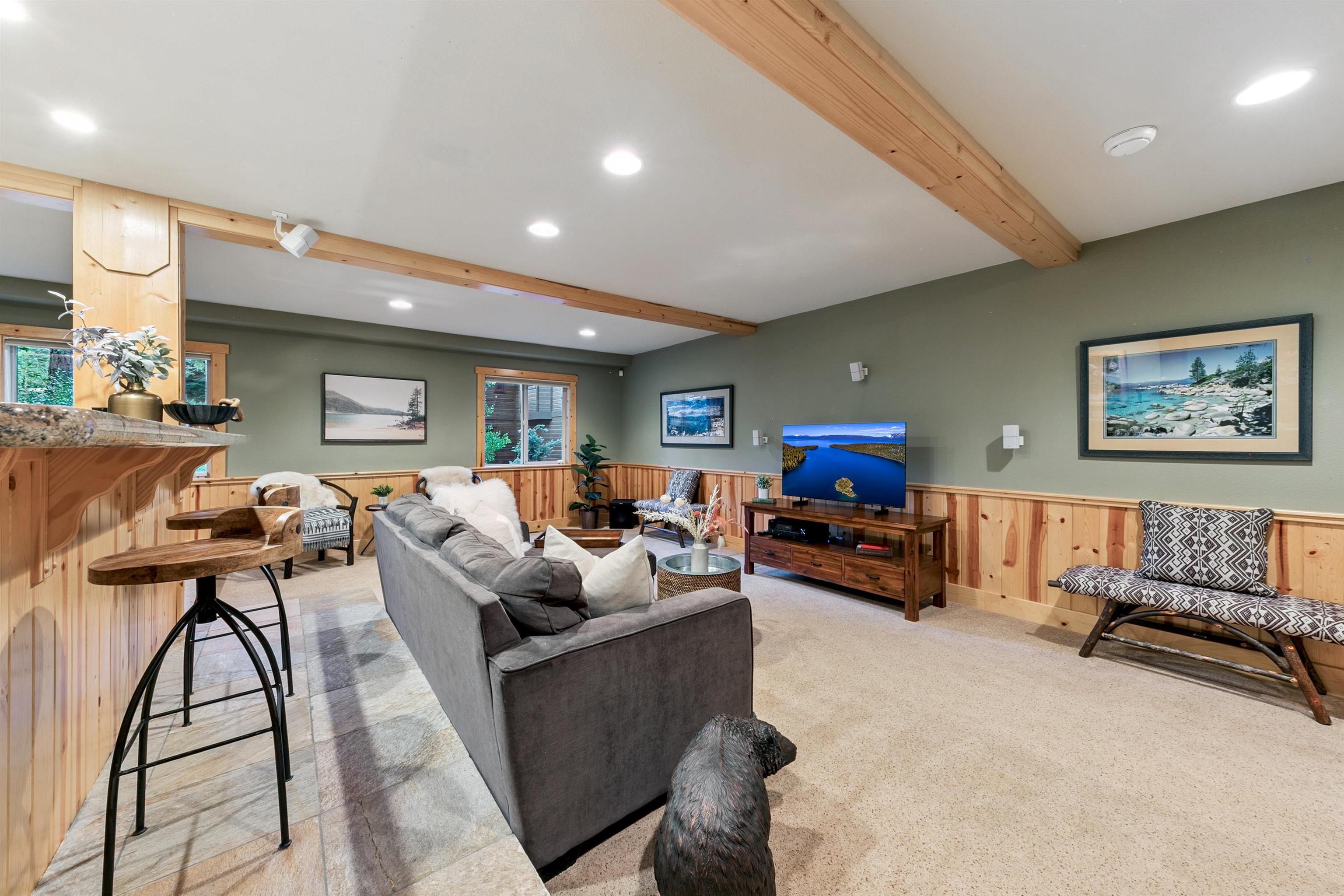 11781 Chamonix Road Truckee, CA 96161 - Photo 19 of 28 a living room with furniture and a flat screen tv