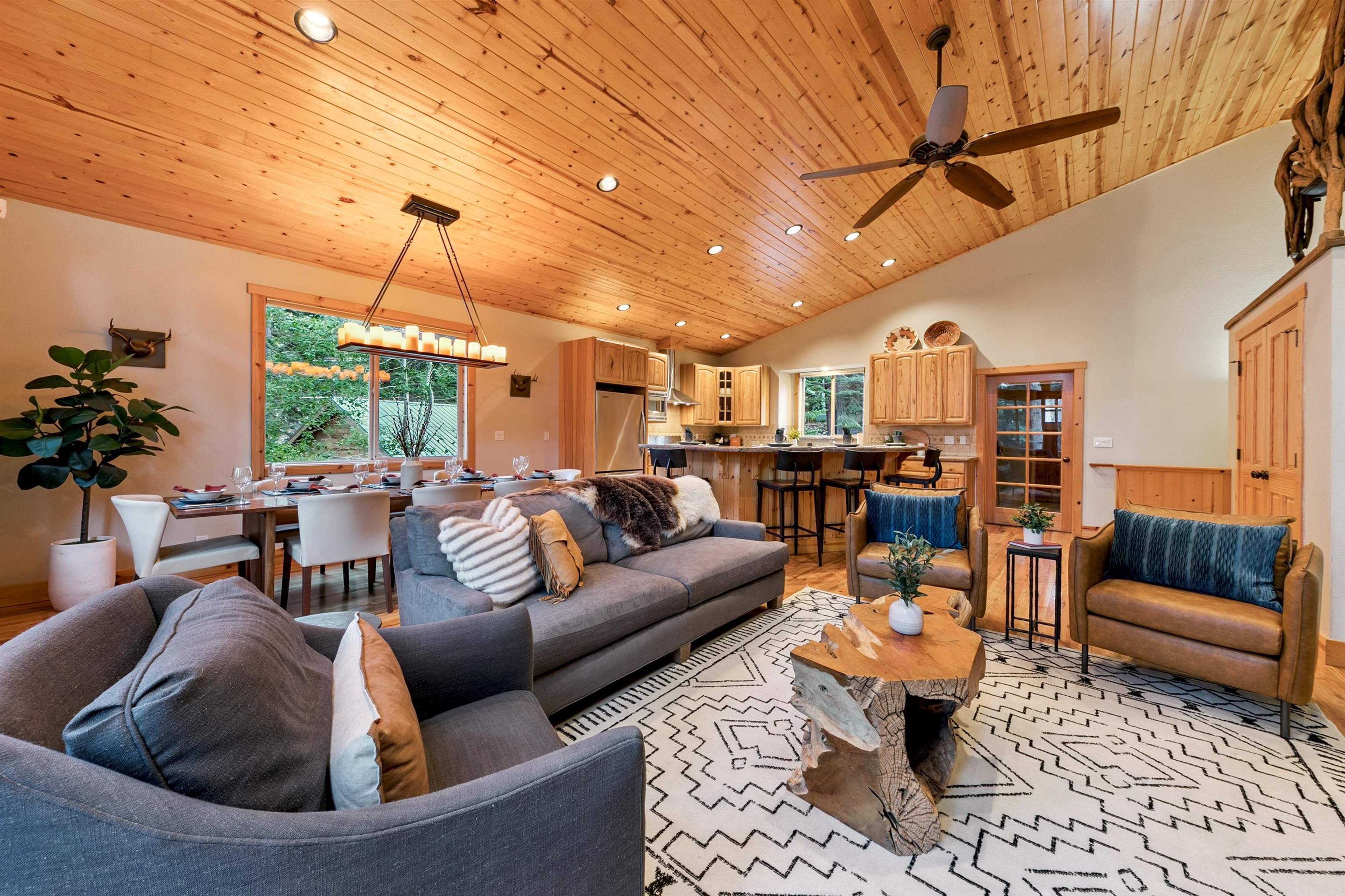 11781 Chamonix Road Truckee, CA 96161 - Photo 5 of 28 a living room with furniture and a chandelier