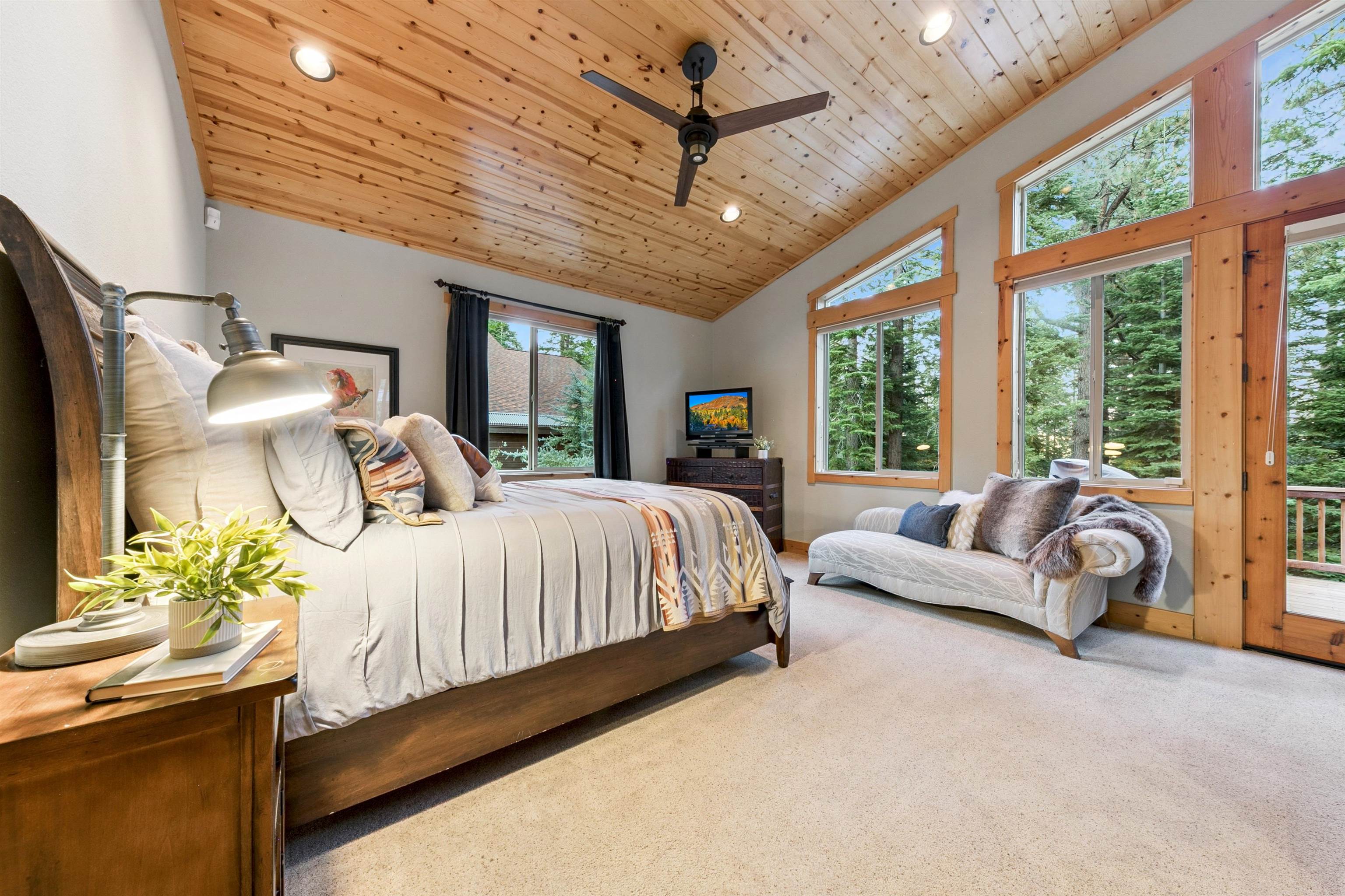 11781 Chamonix Road Truckee, CA 96161 - Photo 10 of 28 a bedroom with a bed couch and window